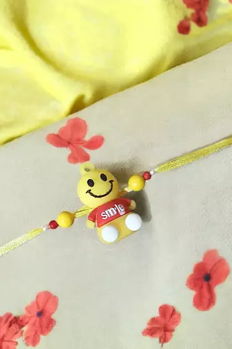 Smiley charm rakhi – fun and playful kids rakhi with bright smiley design