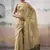Cream tissue silk with beautiful tussle festival wear saree