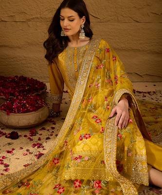 Women yellow silk blend solid woven design straight kurta trousers with dupatta 1
