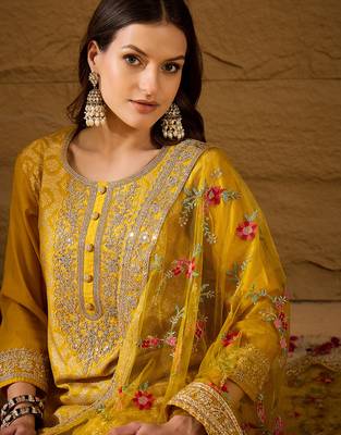 Women yellow silk blend solid woven design straight kurta trousers with dupatta 2