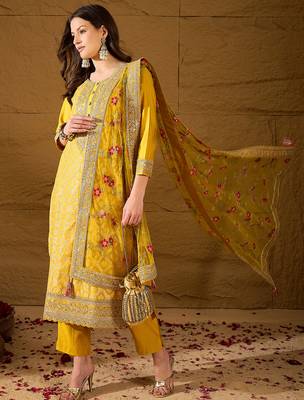 Women yellow silk blend solid woven design straight kurta trousers with dupatta 3