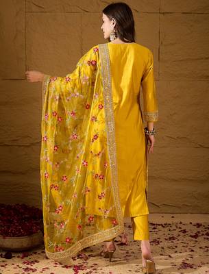 Women yellow silk blend solid woven design straight kurta trousers with dupatta 4