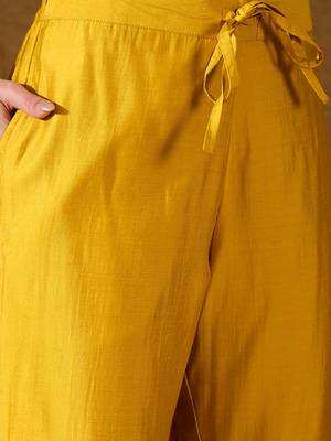 Women yellow silk blend solid woven design straight kurta trousers with dupatta 5
