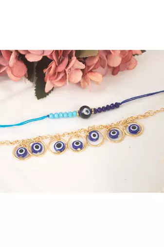 Handcrafted combo of evil eye protective rakhi for bhaiya bhabhi with roli chawal and written greeting note.