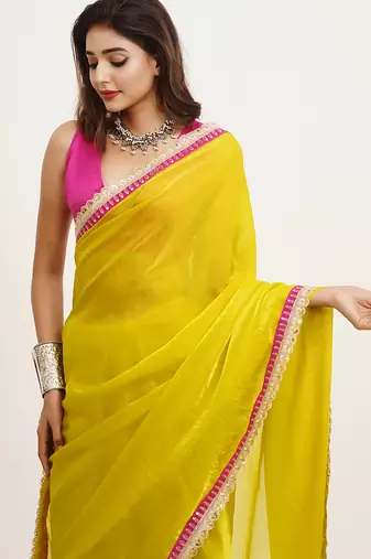Metallic yellow partywear embellished sequinned satin saree