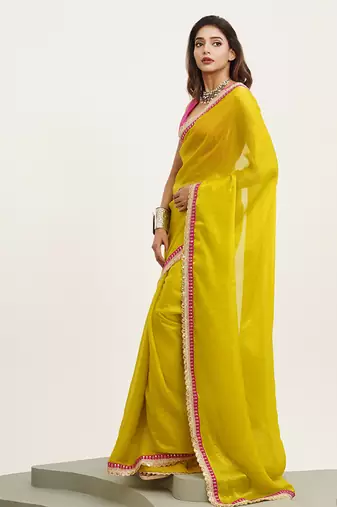 Metallic yellow partywear embellished sequinned satin saree