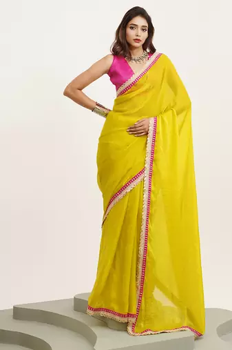 Metallic yellow partywear embellished sequinned satin saree