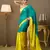Teal color chiffon fabric motiwork lace colorblocked ceremonial saree