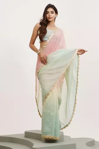 Pink color tissue fabric embellished sequinned work fancy saree