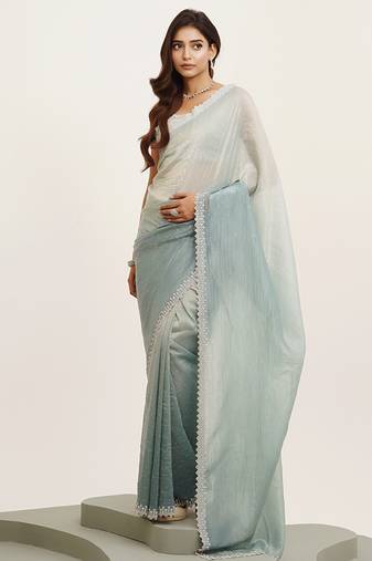Turquoise blue color tissue fabric embellished beads and stones work fancy saree