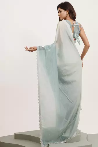 Turquoise blue tissue embellished beads and stones work fancy saree