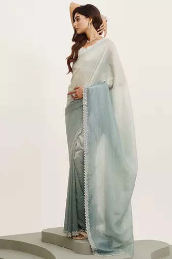 Turquoise blue tissue embellished beads and stones work fancy saree