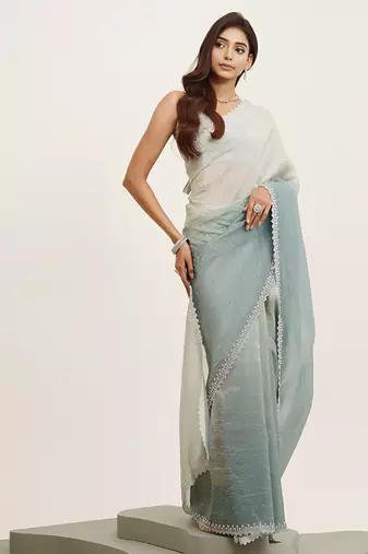 Turquoise blue tissue embellished beads and stones work fancy saree