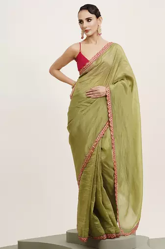 Green color tissue fabric embellished sequinned work fancy saree