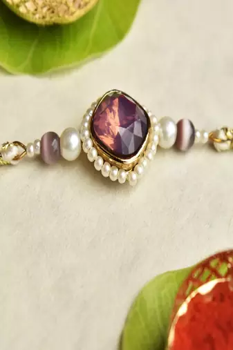 Royal amethyst pearl rakhi with roli chawal capsules