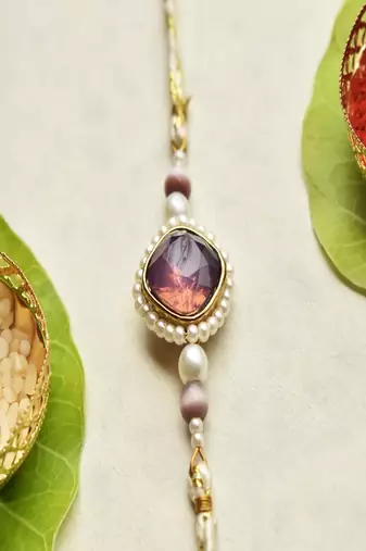 Royal amethyst pearl rakhi with roli chawal capsules