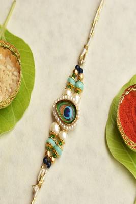Mor pankh beaded rakhi with roli chawal capsules 1