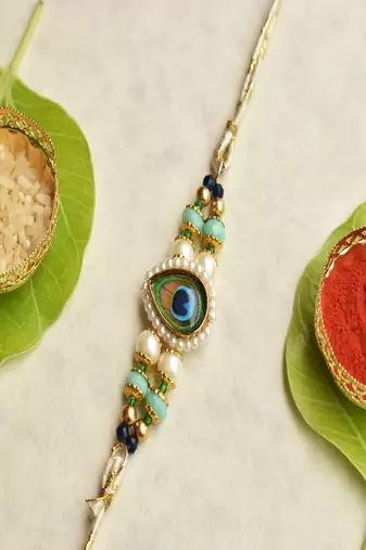 Mor pankh beaded rakhi with roli chawal capsules