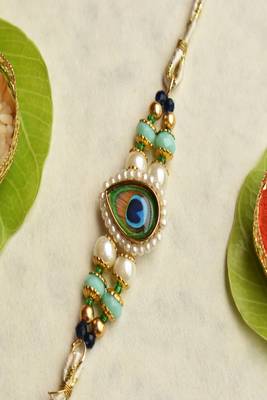 Mor pankh beaded rakhi with roli chawal capsules 2