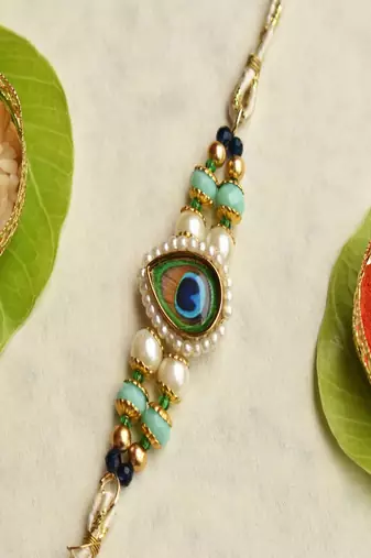 Mor pankh beaded rakhi with roli chawal capsules