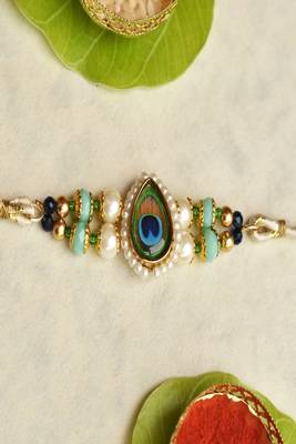 Mor pankh beaded rakhi with roli chawal capsules 3