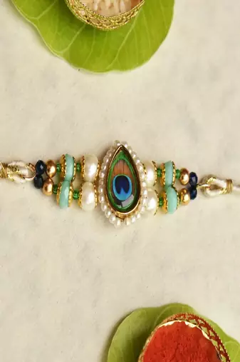 Mor pankh beaded rakhi with roli chawal capsules
