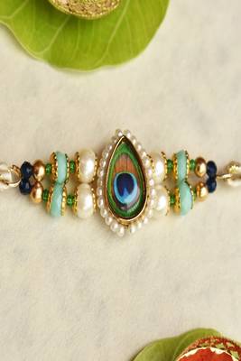 Mor pankh beaded rakhi with roli chawal capsules 4