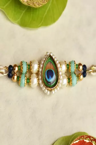 Mor pankh beaded rakhi with roli chawal capsules