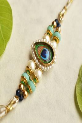Mor pankh beaded rakhi with roli chawal capsules 5