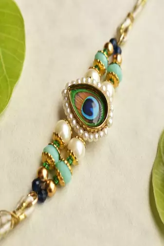 Mor pankh beaded rakhi with roli chawal capsules