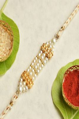 Pearl harmony rakhi with roli chawal capsules 1