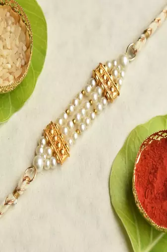Pearl harmony rakhi with roli chawal capsules