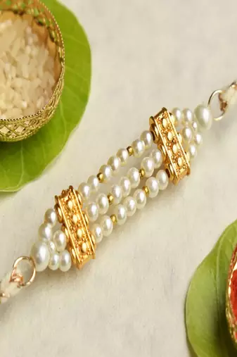 Pearl harmony rakhi with roli chawal capsules