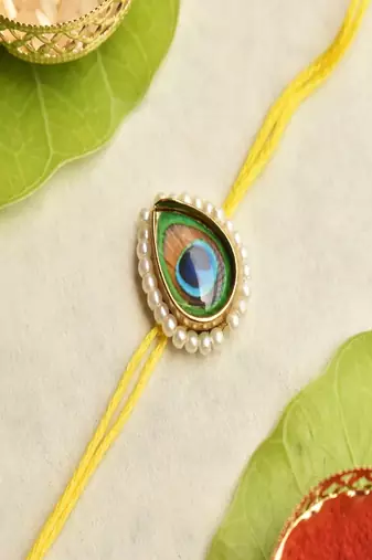 Mor pankh rakhi with roli chawal capsules