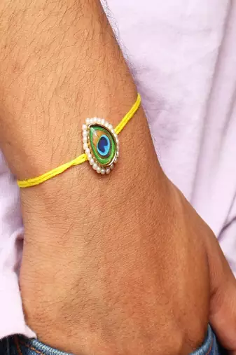 Mor pankh rakhi with roli chawal capsules