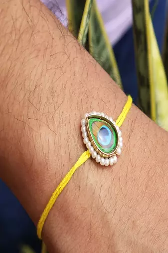 Mor pankh rakhi with roli chawal capsules