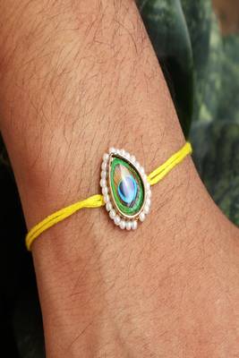 Mor pankh rakhi with roli chawal capsules 4