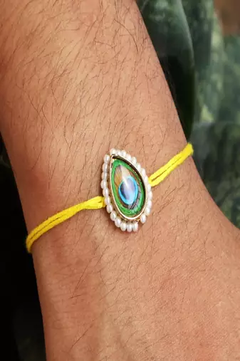 Mor pankh rakhi with roli chawal capsules