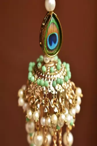 Peacock jhoomar lumba with roli chawal capsules