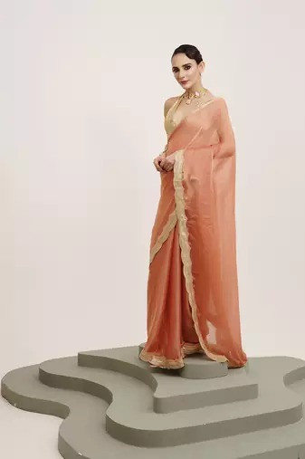 Embellished sequinned work peach satin rich ceremonial saree