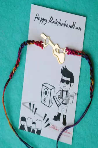 Guitar quirky rakhi with roli chawal capsules