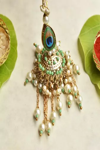 Peacock glory rakhi & jhoomar lumba set with roli chawal capsules