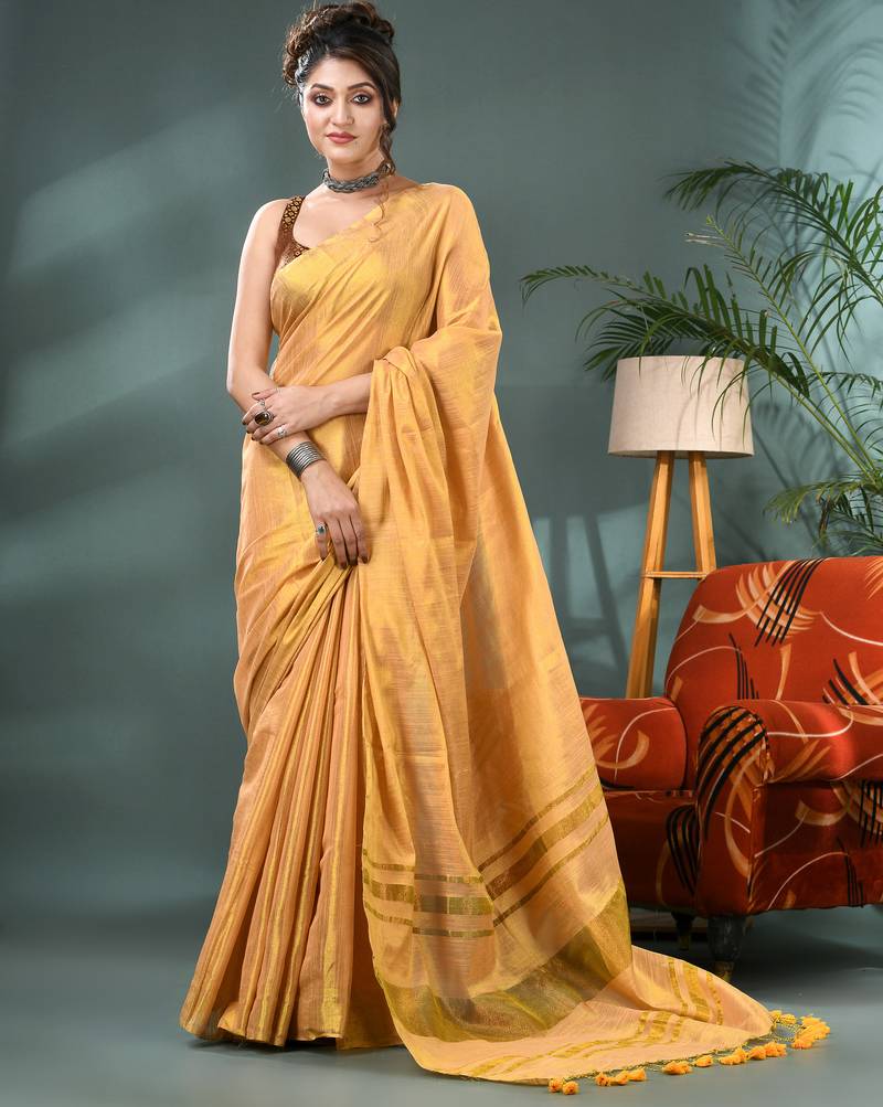 Gold soft linen tissue silk saree with blouse piece