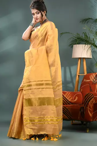 Gold soft linen tissue silk saree with blouse piece