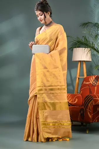 Gold soft linen tissue silk saree with blouse piece