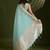 Sea green zari woven silk blend saree with contrast blouse