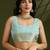 Sea green zari woven silk blend saree with contrast blouse