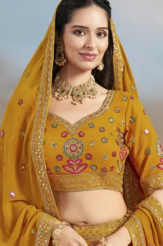 YELLOW GEORGETTE SEQUINS THREAD ZARI EMBROIDERED LEHENGA CHOLI