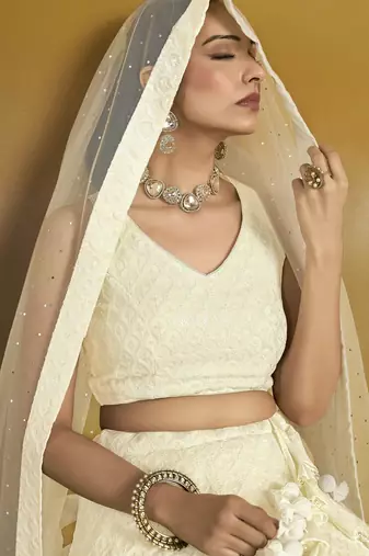 WHITE GEORGETTE SEQUINS THREAD EMBROIDERED LEHENGA CHOLI
