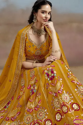YELLOW GEORGETTE SEQUINS THREAD ZARI EMBROIDERED LEHENGA CHOLI